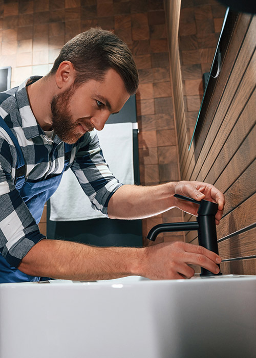Plumber_Working_On_Sink_Best1_Plumbing_and_Heating