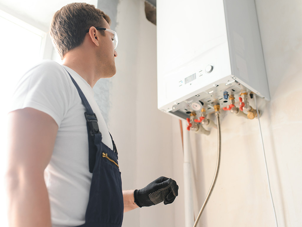 Professional_Plumber_Checking_Boiler_System_Setup_Best1_Plumbing_and_Heating
